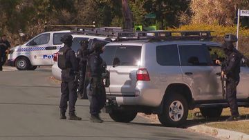 Police have locked down streets as officers negotiate with a man