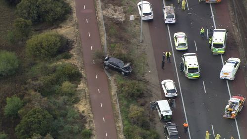 Another vehicle, a Commodore, lost control and swerved off the free, crashing into nearby bushland. Picture: 9NEWS