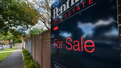 A for sale sign on a home.