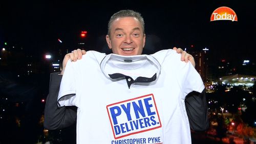 Mr Pyne unveils his own 'Pyne delivers' T-shirt. (9NEWS)