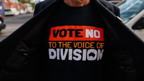 A volunteer wearing a 'Vote No' T-Shirt