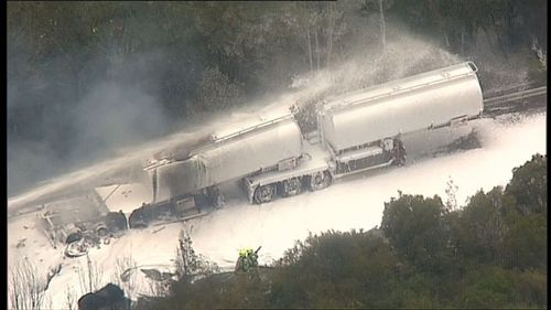 Ninety minutes after this M1 accident, two more truck drivers were killed in a head-on collision in Grafton (9NEWS).