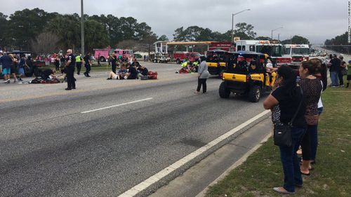 Up to 11 high school students injured after car ploughs into crowd during Mardi Gras parade