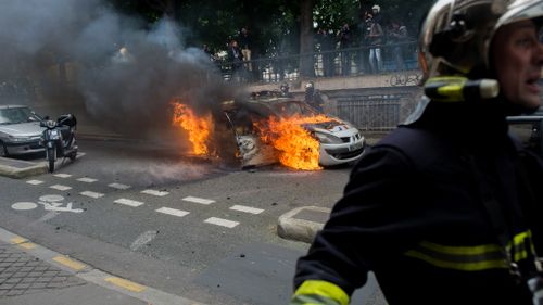 Police cars were torched at the rally. (AFP)