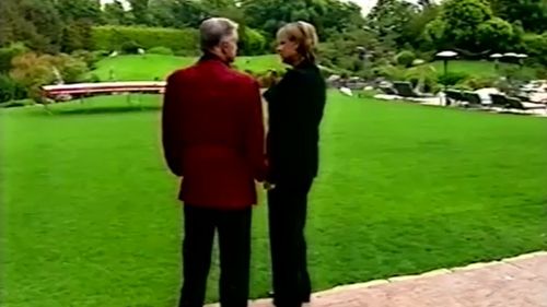 Hefner with Hayes outside the Playboy Mansion in Beverly Hills, Los Angeles. (60 Minutes)