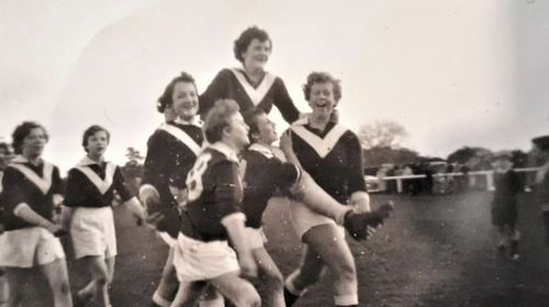 The farm team celebrating with captain Margaret Hassett, 1953.