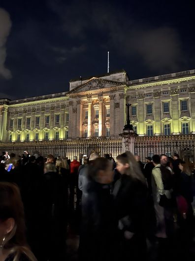 Crowds continue to gather outside Buckingham Palace at close to midnight in London, hours after news of Queen Elizabeth's death
