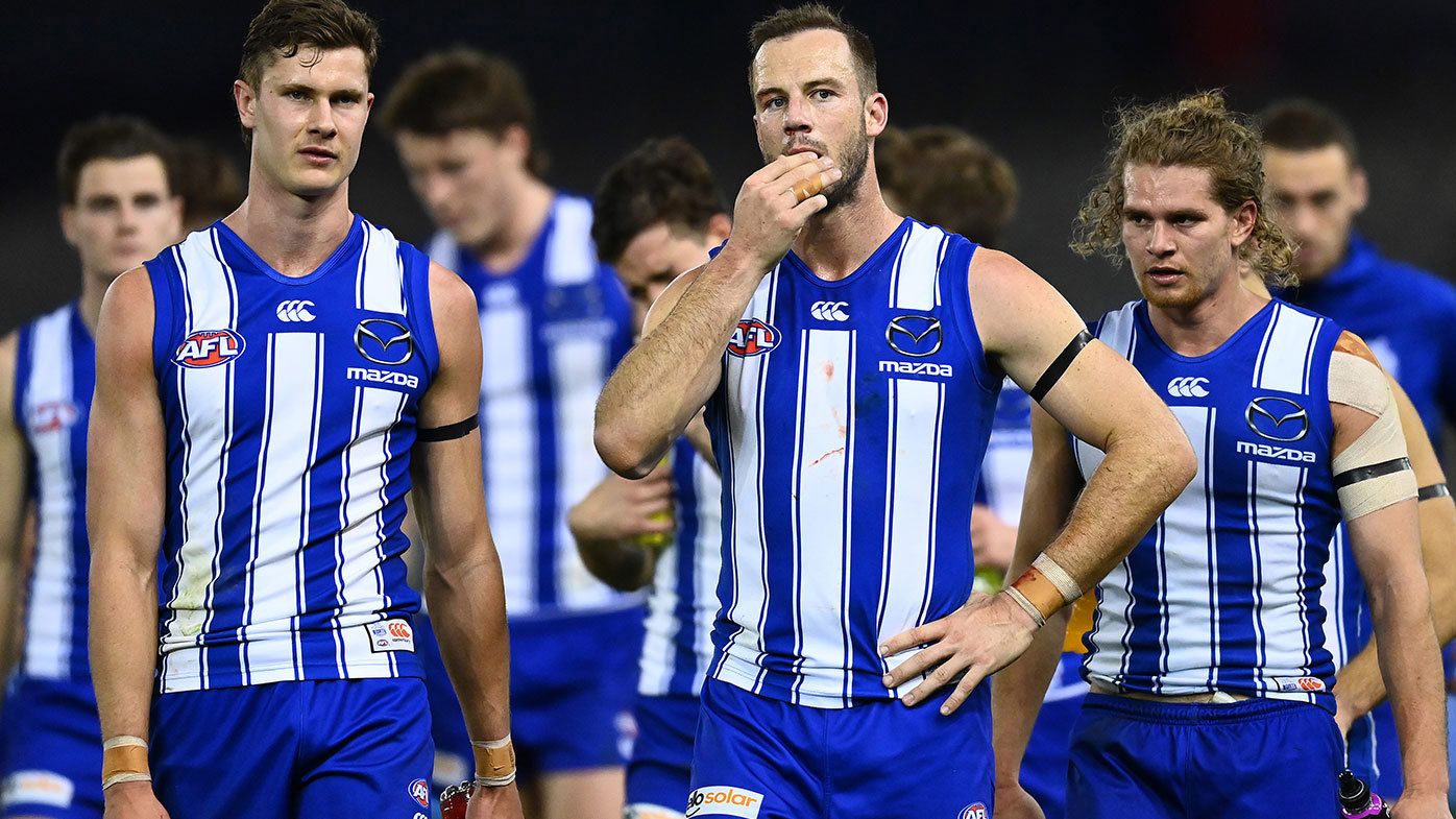 The Kangaroos look dejected after losing the round 22 AFL match between North Melbourne Kangaroos and Sydney Swans at Marvel Stadium on August 14, 2021 in Melbourne, Australia. (Photo by Quinn Rooney/Getty Images