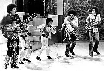 When did the Jackson 5 sign with Motown Records?