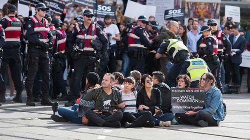 Police move in on animal rights protesters who had blocked the intersections of Flinders and Swanston Street, in Melbourne.