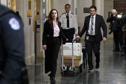 Documents arrive as the House Ways & Means Committee holds a hearing regarding tax returns from former President Donald Trump on Capitol Hill in Washington, Tuesday, Dec. 20, 2022 