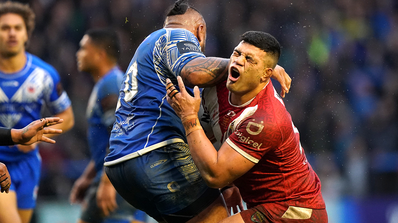 Tonga&#x27;s David Fifita is tackled by Samoa&#x27;s Junior Paulo during their Rugby League World Cup quarterfinal.