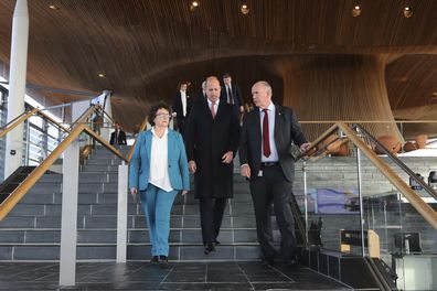 Prince William, centre, walks with Senedd members Elin Jones, left, and David Rees during a visit to the Senedd, the Welsh Parliament, in Cardiff, Wales, Wednesday November 16, 2022 