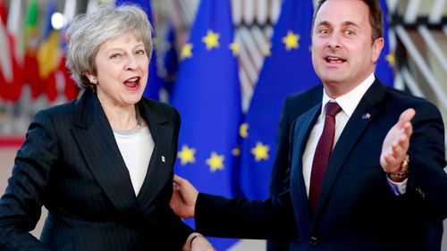 British Prime Minister Theresa May and Luxembourg Prime Minister Xavier Bettel arrive at the European Council in Brussels, Belgium.