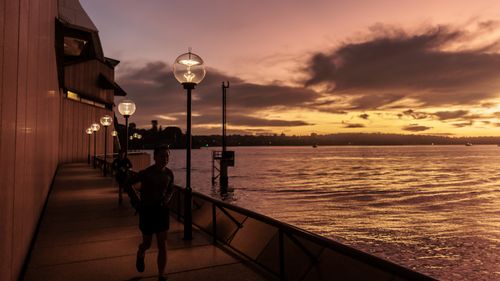 Dawn on the Harbour on the Winter Solstice as the afterglow caused by a Volcanic eruption in Tonga continues on 21 June 2022.