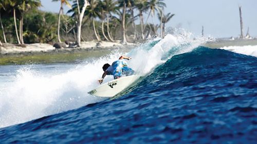 The last photo of Darren surfing in Sumatra, hours before his accident which robbed him of the use of his legs and fingers. Picture: Supplied..