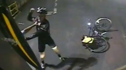 CCTV captured the cyclist allegedly attacking a bus driver at an inner-city depot. (9NEWS)