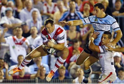 ...while teammate Brett Morris scored one of the great winger's tries against Cronulla.