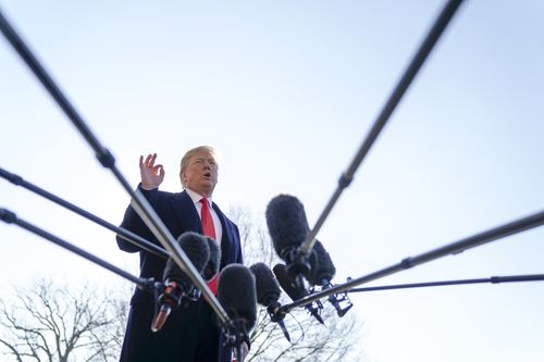 Mr Trump speaks to journalists after announcing the firing of Mr Tillerson. (AP)