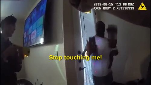 Shocking footage has emerged of the moment police in the US city of Knoxville fired a taser at a father while he was holding his child.