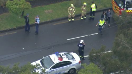 Emergency services at the scene of a fatal accident at Chatswood involving a car and a pedestrian. (9 News)