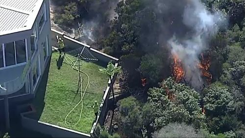 A hazard reduction burn came close to mansions on Sydney's northern beaches.