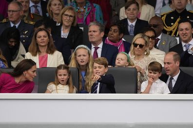 Prince William, right, and Kate, Duchess of Cambridge, left, attend with their children Prince George, center, Princess Charlotte, second left, and Prince Louis the Platinum Jubilee Pageant outside Buckingham Palace in London, Sunday, June 5, 2022, on the last of four days of celebrations to mark the Platinum Jubilee. 