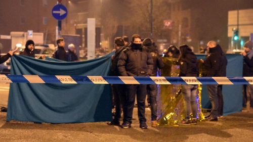 Police guard the scene in Milan where Amri was killed. (AAP)