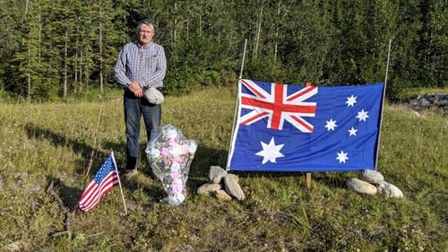 Whitehorse trucker Ed Grennan couldn't stand to leave the spot where Lucas Fowler and Chynna Deese were murdered empty. So he returned with a floral cross and a flag for each victim.