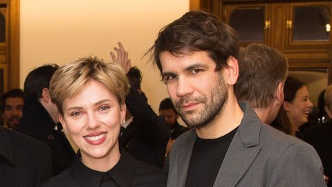 Scarlett Johansson and husband Romain Dauriac cozied up at an art gallery opening in NYC.