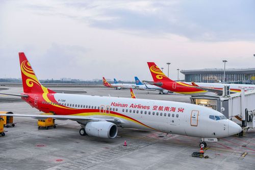 Hainan Airlines planes sit on the tarmac.