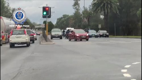 Cars were forced to change lanes and drive around the assembly, which was blocking traffic on the Great Western Highway. Picture: NSW Police