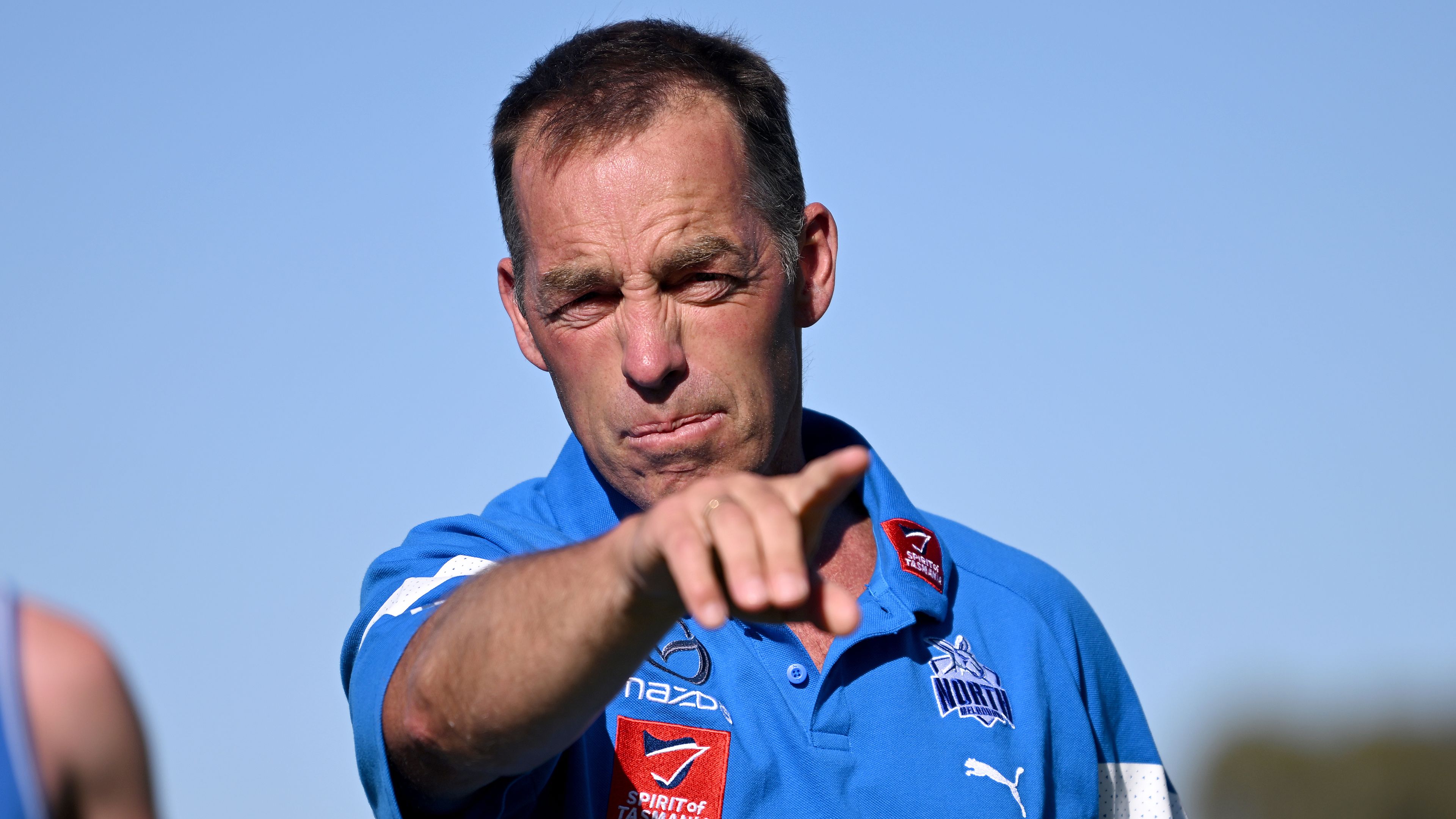 ROCHESTER, AUSTRALIA - FEBRUARY 13: Alastair Clarkson, senior coach of the Kangaroos talks Rochester footballers through a training drill during the North Melbourne Kangaroos AFL Community Camp at the Rochester Recreation Reserve on on February 13, 2023 in Rochester, Australia. (Photo by Morgan Hancock/Getty Images)