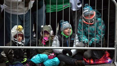 Young Philadelphia Eagles NFL football team fans wait behind a barricade for the start of the Eagles team parade and celebration. (AAP)