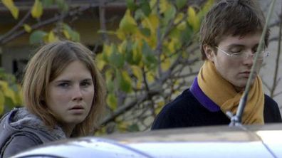 Amanda Knox with Raffaele Sollecito pictured outside the rented house where Meredith Kercher was found dead in Perugia, Italy. (AP)