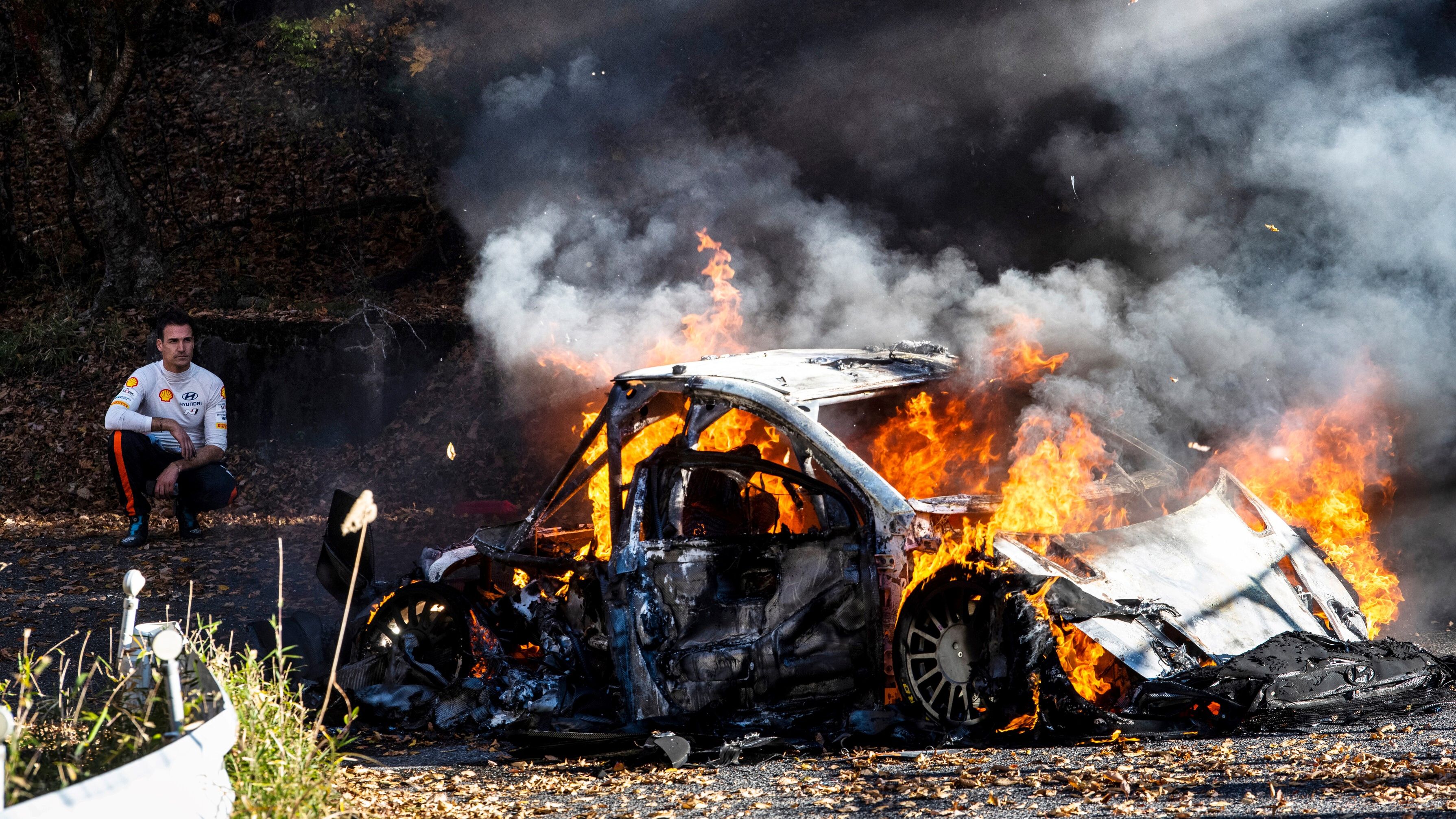 Dani Sordo looks on as his Hyundai i20 N burns to the ground.
