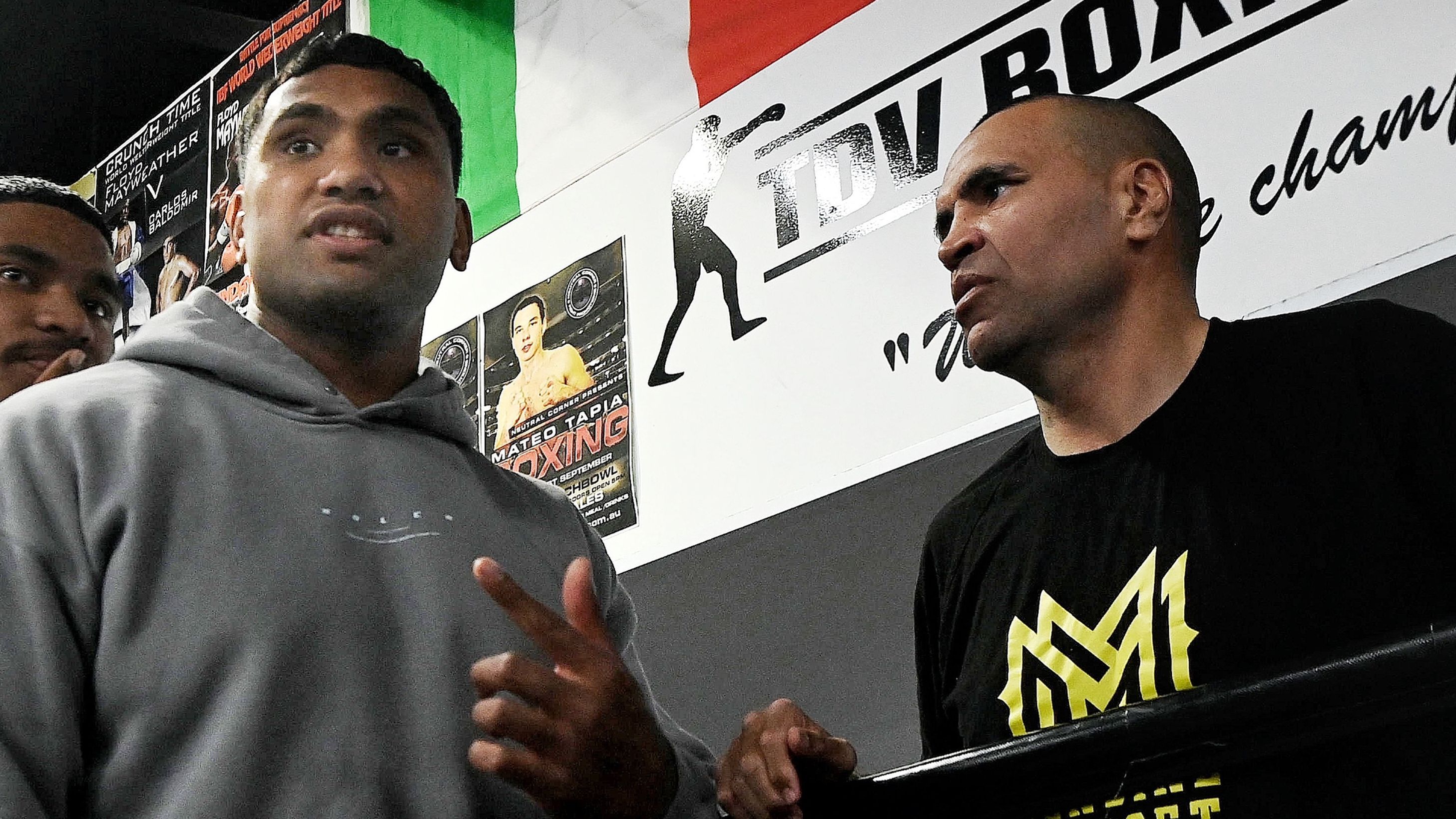 Tevita Pangai (centre) with his brother Jermaine Pangai  (left) with Anthony Mundine (right) at the Bondi Boxing Club in Waterloo.