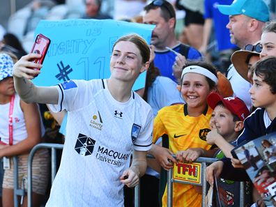 Cortnee Vine of Sydney FC takes selfies with fans during the A-League Women round two match between Brisbane Roar and Sydney FC at Ballymore Stadium, on October 21, 2023, in Brisbane, Australia. 