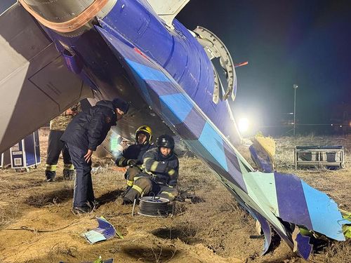 In this photo released by Kazakhstan's Emergency Ministry Press Service, rescuers work at the wreckage of Azerbaijan Airlines Embraer 190 lies on the ground near the airport of Aktau, Kazakhstan, Thursday, Dec. 26, 2024. (Kazakhstan's Emergency Ministry Press Service via AP)