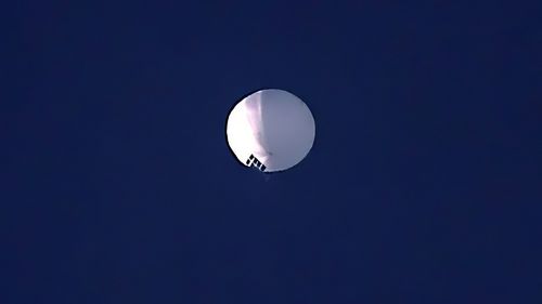 A high altitude balloon floats over Billings, Mont., on Wednesday, Feb. 1, 2023. 