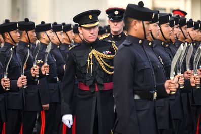 LONDON, ENGLAND - SEPTEMBER 08: Brigade Major of the Household Division Lt Col James Shaw (C) checks uniforms as members of the 94 Squadron of the Queen's Own Gurkha Logistic Regiment stand to attention during a final inspection parade at Wellington Barracks on September 08, 2022 in London, England. The inspection was to determine if the soldiers were fit for role as potential future Queens Guards, with their first Queens Guard set to take place at Buckingham Palace on September 12. (Photo by Le
