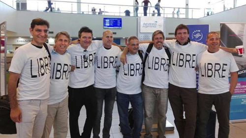 Wearing shirts with the Spanish word for 'free' are Argentinian friends Hernan Ferruchi, Alejandro Pagnucco, Ariel Erlij, Ivan Brajckovic, Juan Pablo Trevisan, Hernan Mendoza, Diego Angelini and Ariel Benvenuto, before their trip to New York City. (AAP)