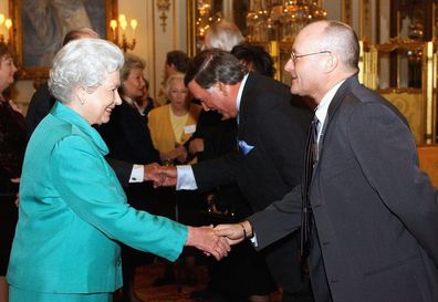 Phil Collins with Queen Elizabeth