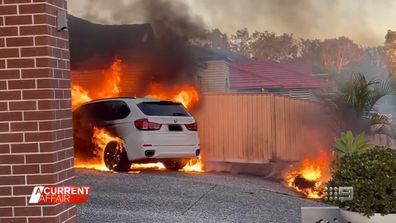 The moment the car erupted into flames was caught on a security camera.