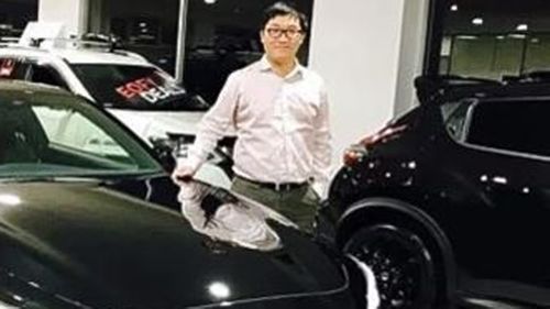 Bo "Nick" Zhao at his car dealership.