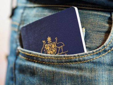 Australian passport in jeans pocket, close up.