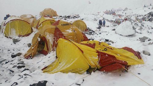 An avalanche swept through Mt Everest base camp, with fears dozens may be buried under heavy snow. (AAP)