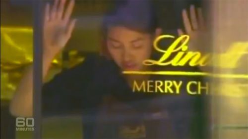 Staff members were forced against the glass of the Lindt Cafe. (9NEWS)