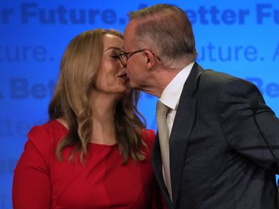 Labor Party leader Anthony Albanese, right, kisses his partner partner Jodie Haydon while thanking supporters at a Labor Party event in Sydney, Australia, Sunday, May 22, 2022