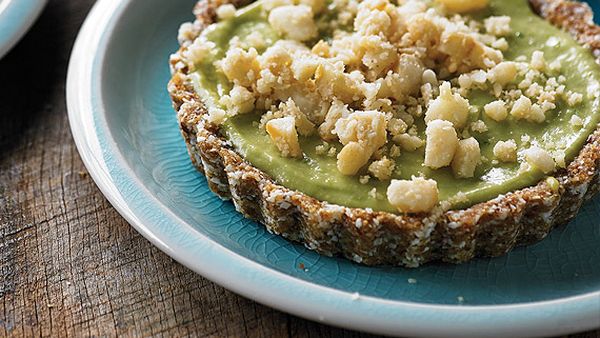 Coconut and lime tartlets topped with macadamia nuts